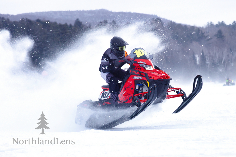 Snowmobile racer competing in the Vermont 100 on Lake Seymour in Morgan, Vermont