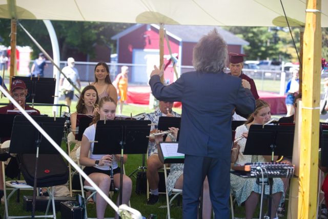conductor readies a band at the North Country Union High School 2026 graduation ceremony
