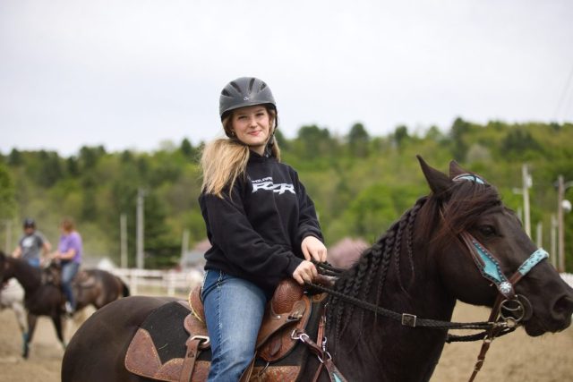 poll and barrels – Mya Patenoude of Newport Center Young rider waits to compete at the Orleans County Fairgrounds